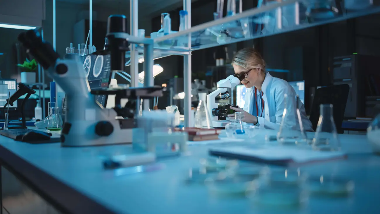 Analytical chemist reviewing a sample in the Protonify laboratory